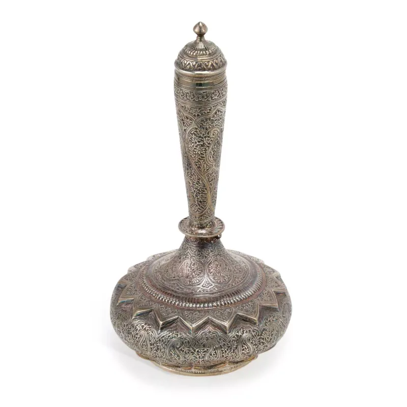 An Indian Silver Rosewater Sprinkler late 19th/ early 20th Century, apparently unmarked, of bottle form with a domed pull-off cover