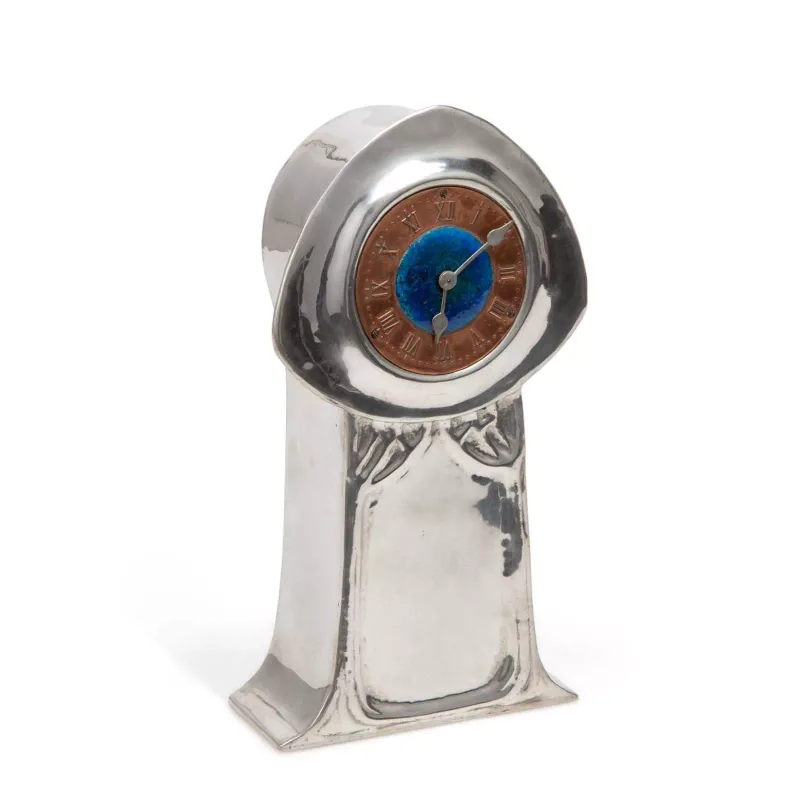 A Liberty & Co Tudric Pewter And Enamel Mantel Clock Designed By David Veasey designed circa 1902, the waisted case of tapering form with a broad domed hood