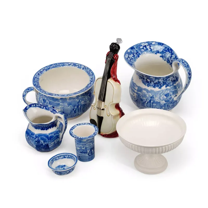 A Group Of Wedgwood Ferrara Pottery Wares Circa 1900 all the pieces printed in underglaze blue with Italian harbour scenes, within floral borders