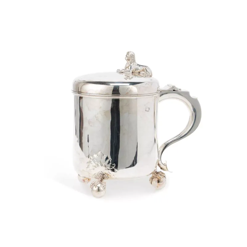 A Large Victorian Silver Lidded Tankard maker's marks rubbed, London possibly 1894, of circular form with a hinged cover