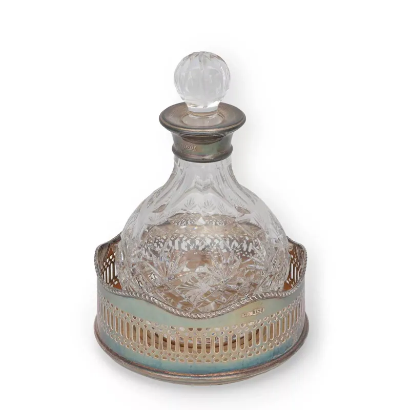 A Silver-Mounted Glass Decanter And A Silver Wine Coaster comprising the decanter by Mappin & Webb Ltd, Birmingham 1998