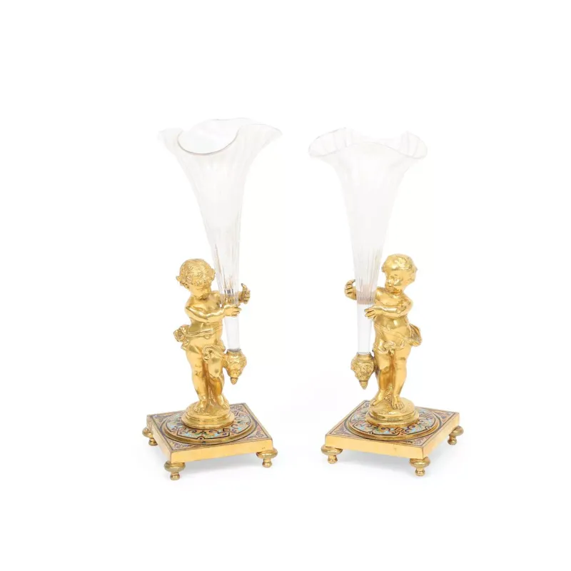 A Pair Of French Gilt Bronze And Champlevé Enamel Figural Vases French, late 19th Century, each cast as a standing putto with a drape about his hips