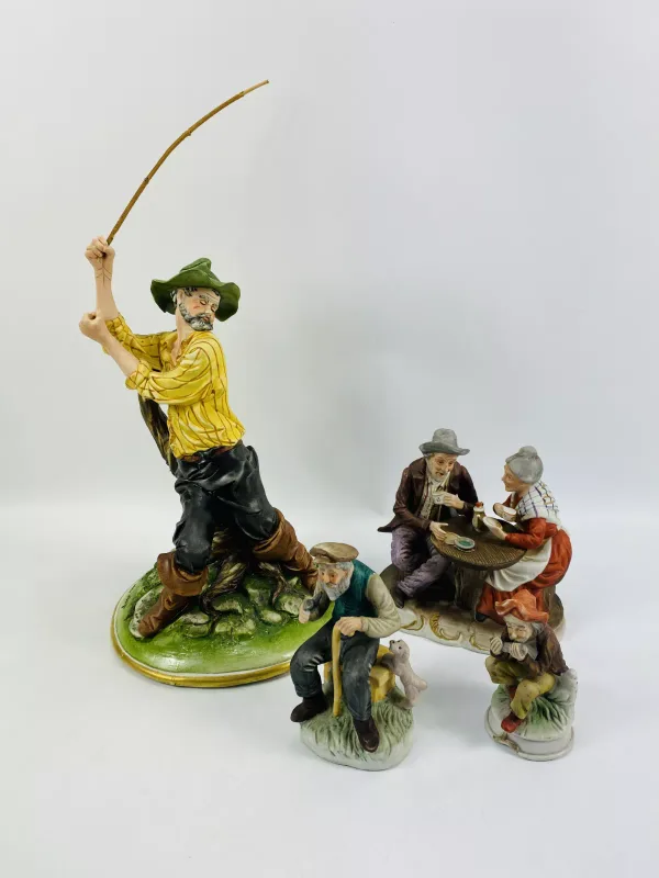 A capodimonte bisque porcelain figure of a fisherman together with three porcelain figures