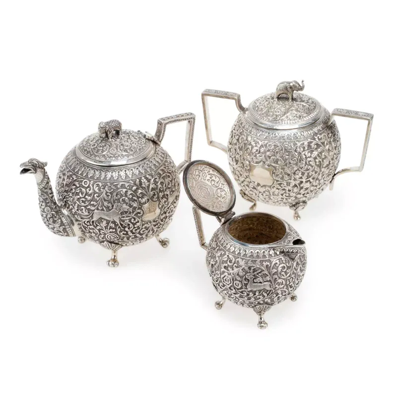 An Indian Silver Matched Three-Piece Tea Service Lucknow, late 19th Century, comprising a teapot, twin-handled sugar bowl and cream jug