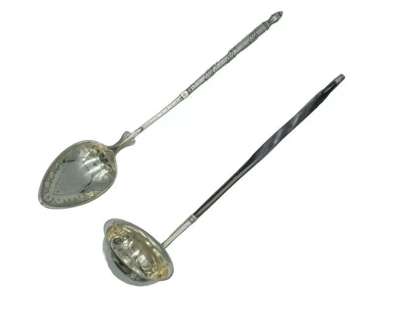 A decorative French silver spoon by Jules Boivin