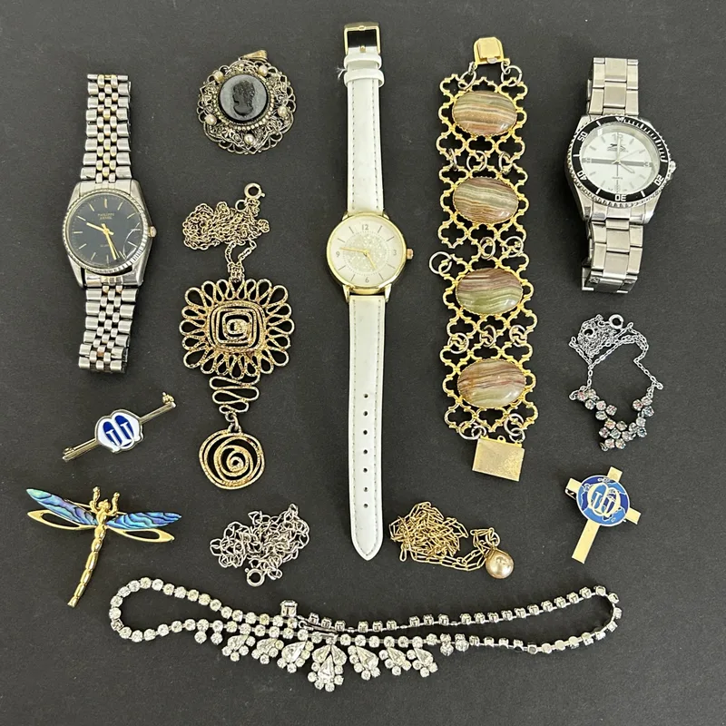 A selection of vintage costume jewellery and wristwatches
