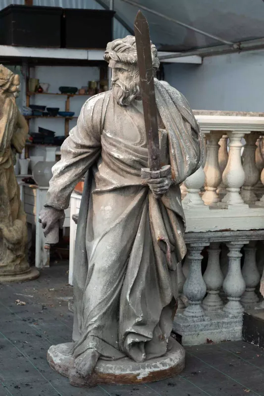 A life sized sculpture of St Paul The sculpture brandishing a sword and wearing classical robes
