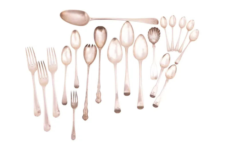 A mixed group of flatware including; a George II Old English pattern basting spoon