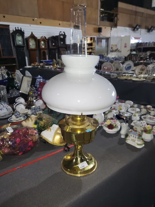 A Victorian Oil lamp with brass base and opaline shade and clear glass funnel