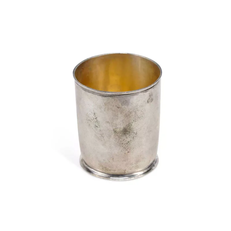 An 18th Century Continental Silver Beaker possibly German (Hanover), maker's mark Ick, of plain form on a spreading circular foot, with gilt bowl.