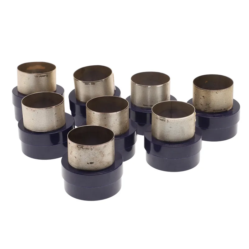 A Set of Eight Individually Cased Modern Silver Napkin Rings