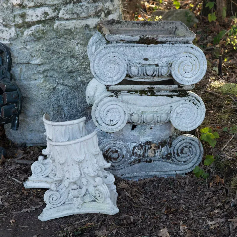A group of fibreglass column capital Three capitals of Ionic form together with two halves of a Corinthian column capital The Ionic capitals