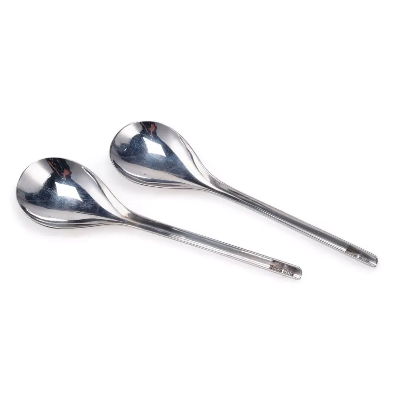 A Pair of Elizabeth II Modernist Silver Spoons by Adrian K