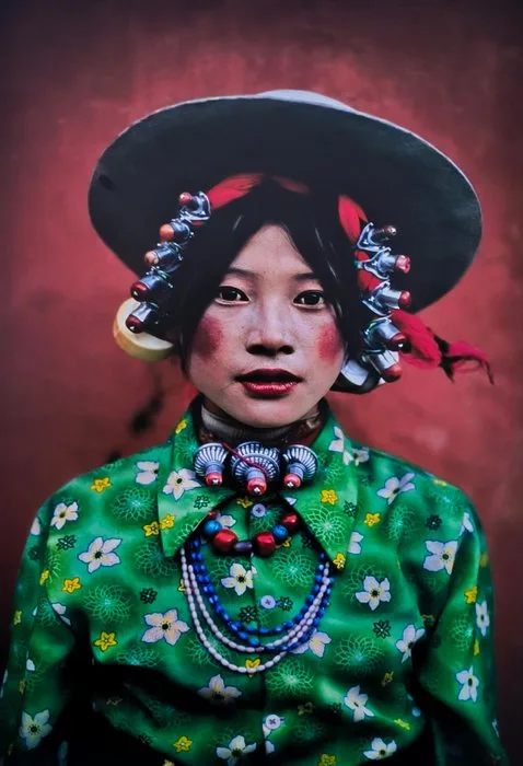 Steve McCurry (1950–) - Woman dressed for the Equestrian Festival in Tagong. Tibet, 1999