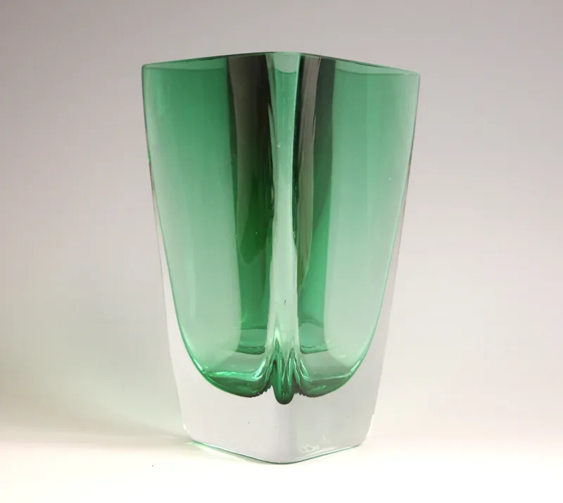 A green studio glass vase in the manner of Orrefors, mid 20th century, of triangular form with heavy base,
