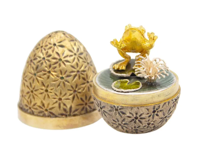 STUART DEVLIN - A "surprise" parcel-gilt and enamel egg