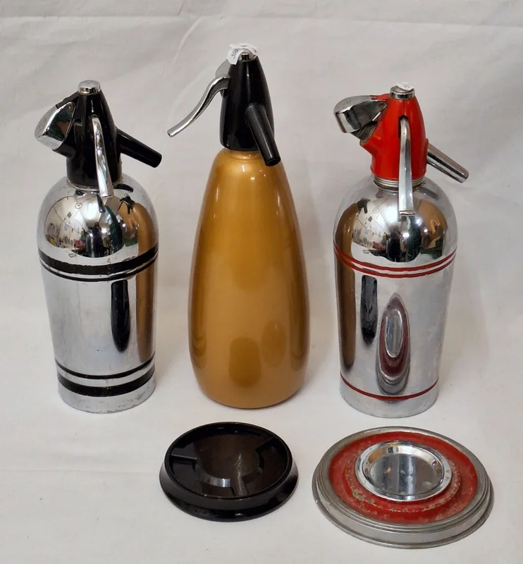 3 Vintage Soda Syphons, chrome & red with original stand, chrome & dull gold with original stand (3)