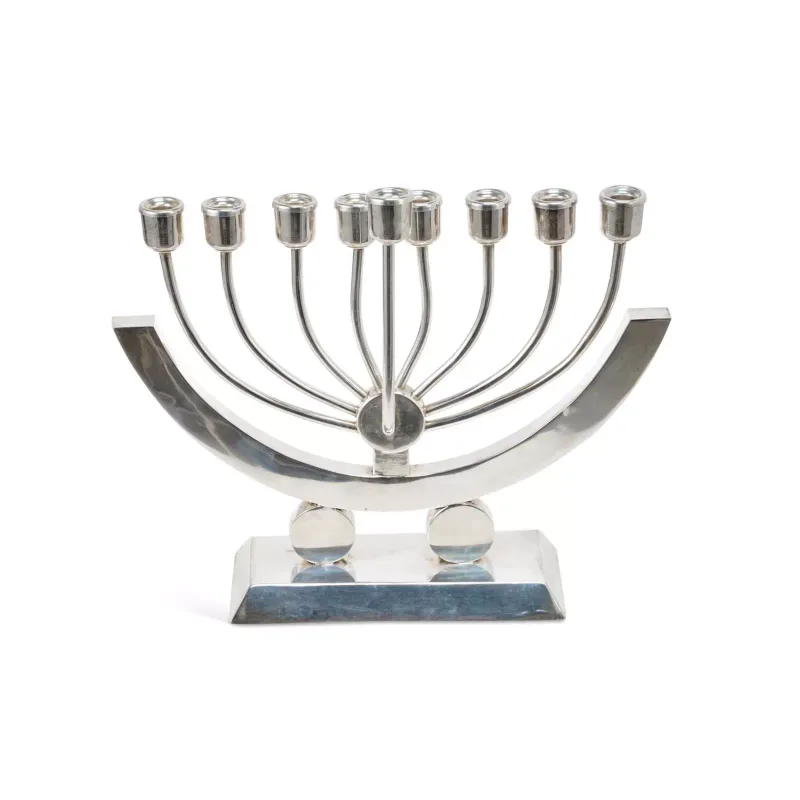 Judaica: A Polish Art Deco Silver Menorah possibly Krakow, circa 1920s, the nine-branch menorah on a crescent shaped stand