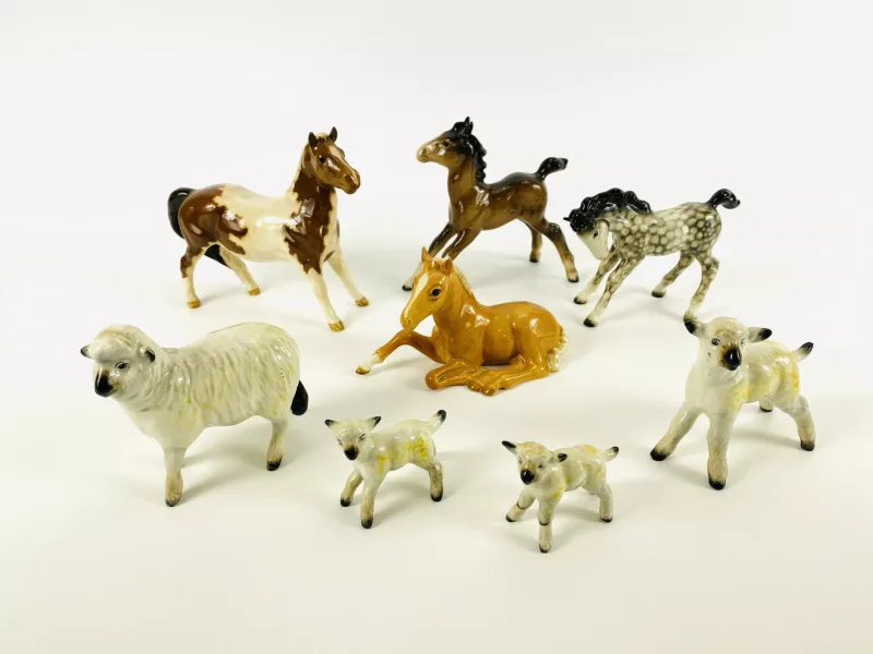 A collection of eight 'Beswick' porcelain animal figurines, to include horses and lambs