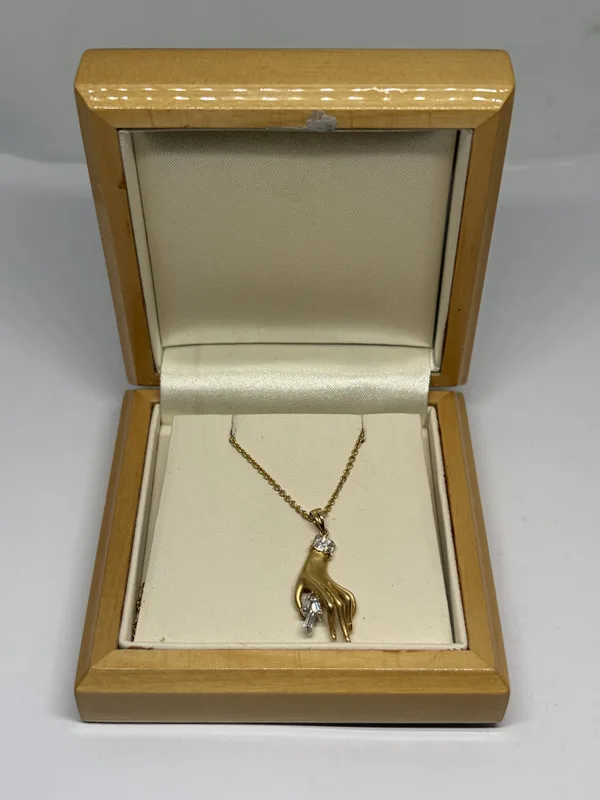 A Carrera Y Carrera 18 Carat Gold and Diamond Pendant and Chain Gross Weight 5.3 Grams in a Presentation Box