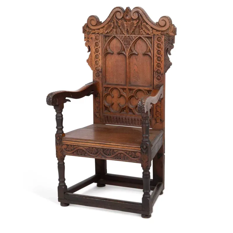 A Carved Oak Armchair 19th Century, in the Gothic taste