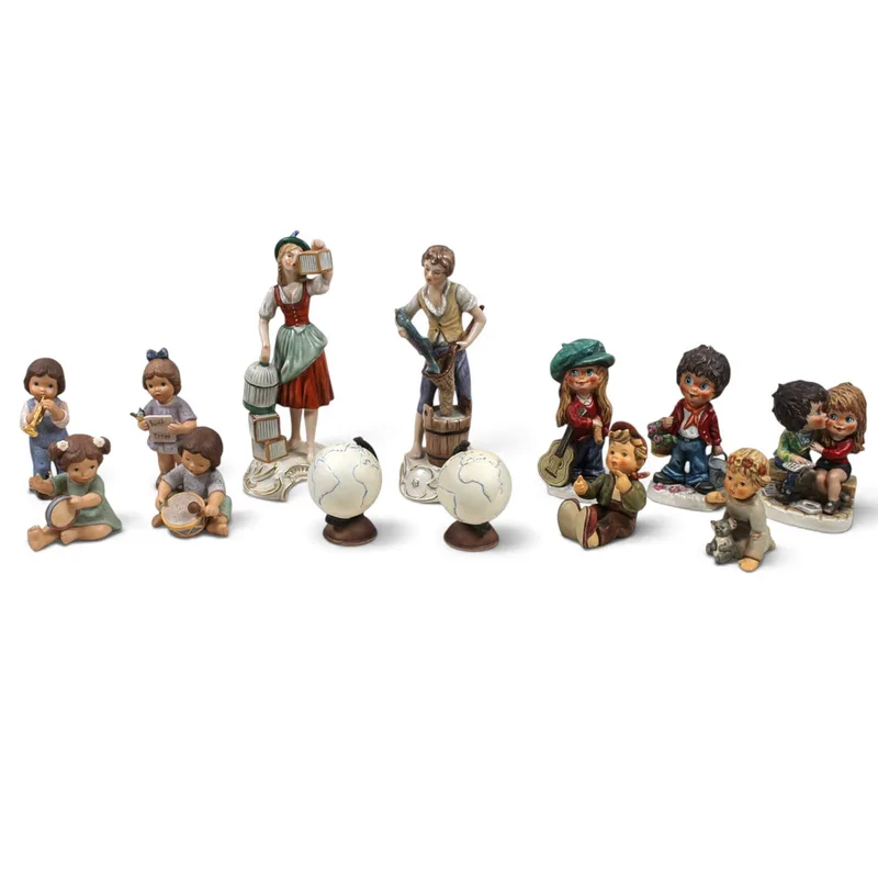 A Group of 13 Goebel Hummel Figurines