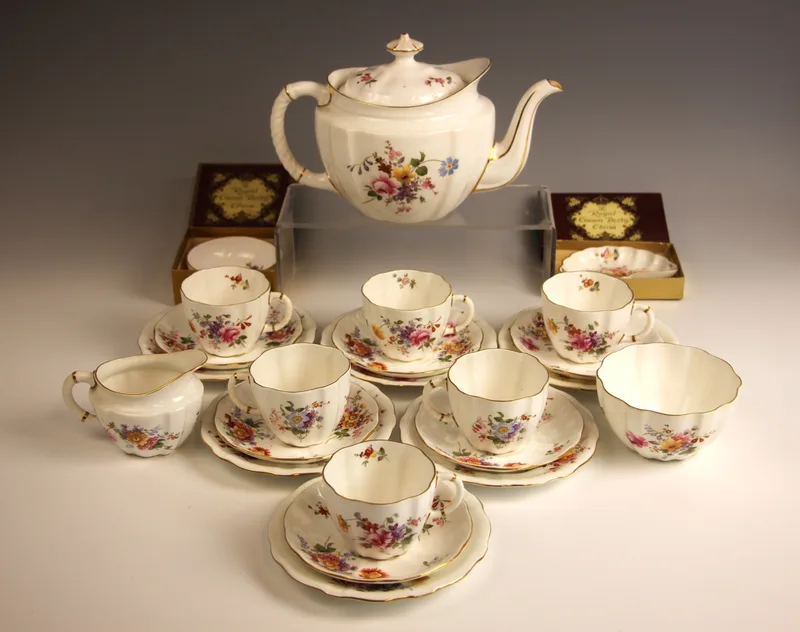 A Royal Crown Derby six place tea service in the 'Derby Posies' pattern, comprising: a teapot and cover