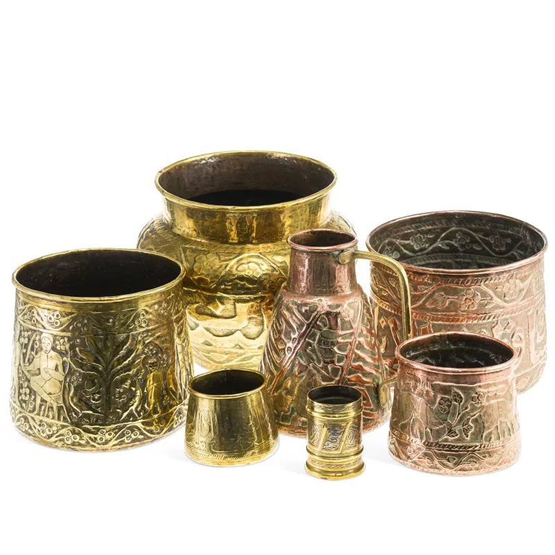 A Collection Of Persian Brass And Copper Vessels 19th Century variously embossed and engraved with figures, animals, foliage and geometric motifs