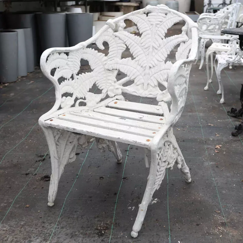A Victorian style garden seat The Coalbrookdale inspired cast aluminium garden seat in the fern pattern with wooden slats and conforming moulded legs