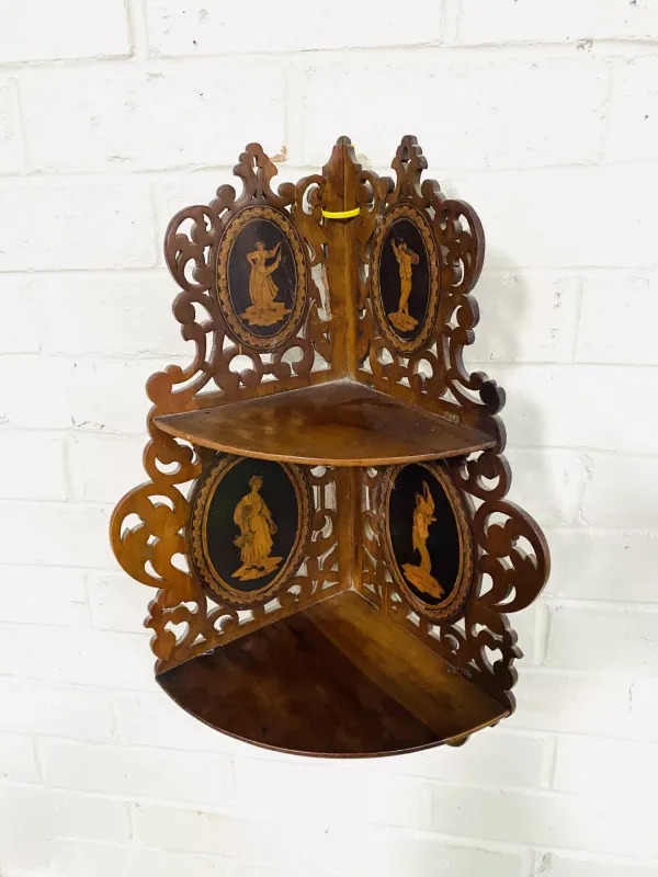 A good late 19th century Sorrento olive wood two tier corner bracket with figural marquetry inlaid decoration