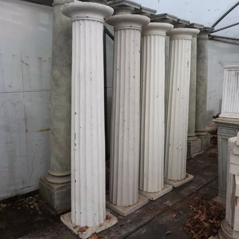 A set of four Doric columns Each column with circular capitals, fluted columns and square bases