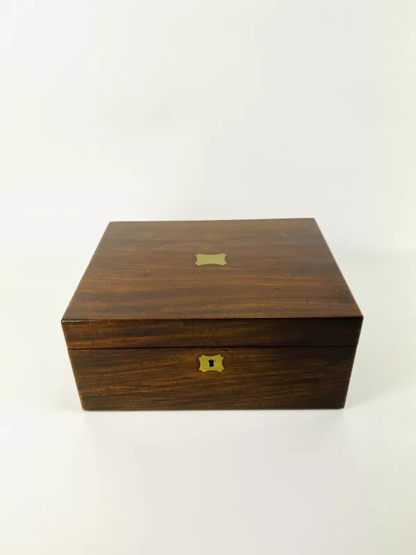 A good quality 19th century mahogany travel box with a fitted interior to include a tea caddy with a sliding top, various size small bottles with stoppers
