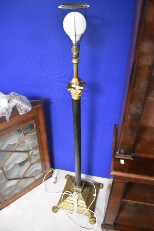 A Neoclassical revival brass and patinated metal Corinthian column standard floor lamp