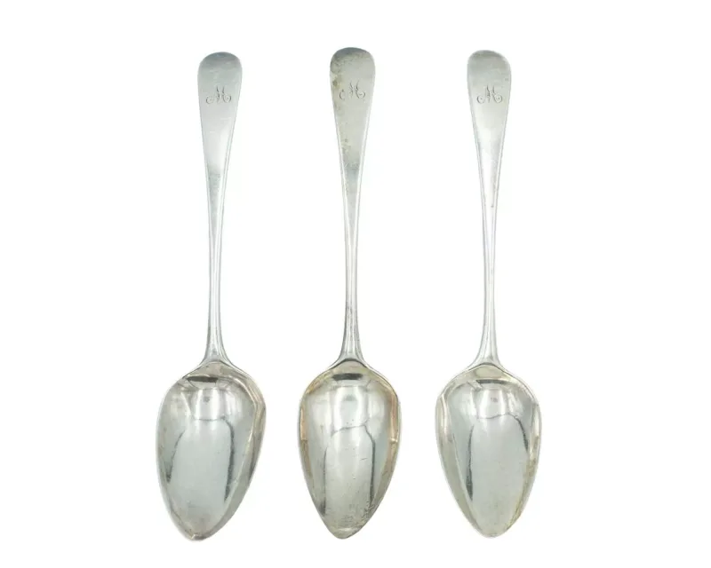 A set of three George III silver Old English pattern dessert spoons by Peter