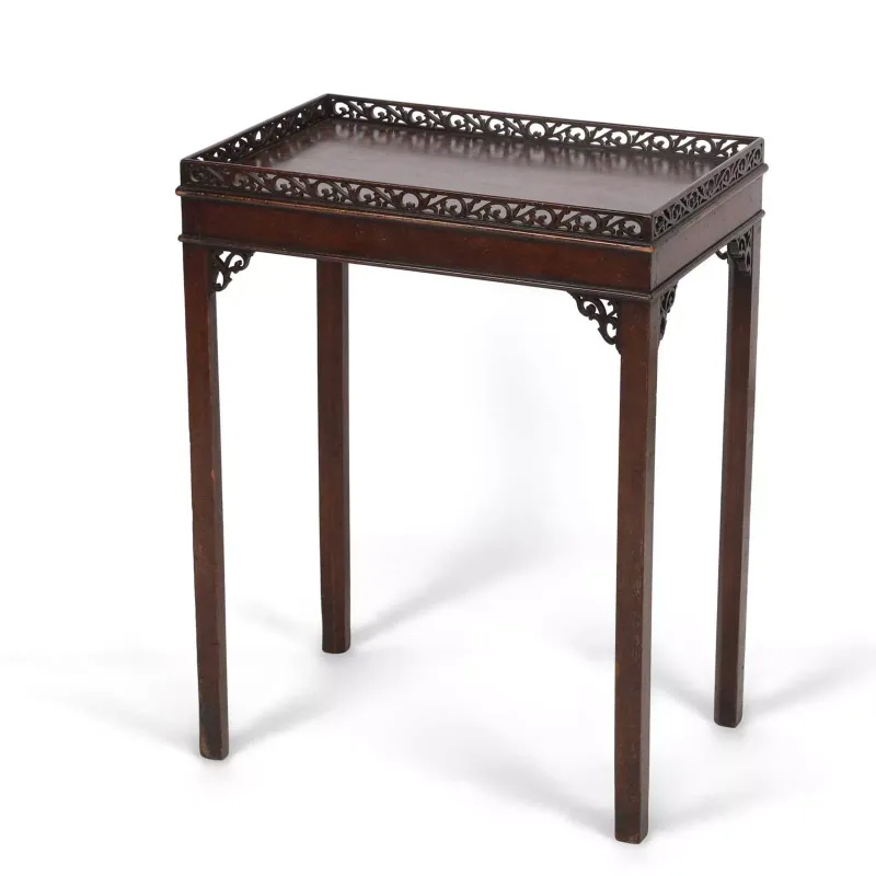 A Mahogany Silver Table in the George III taste, the rectangular top within a pierced fretwork gallery above pierced angle brackets