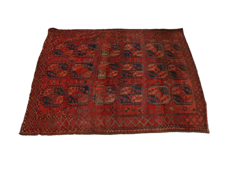 An Ersari Turkmen Main Carpet mid-19th Century, the madder field with three columns of six quartered gulli guls with minor guls between