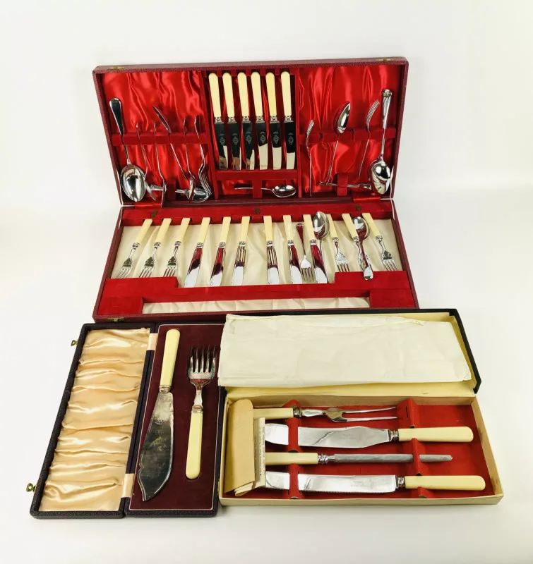 A collection of cased table flatware, a boxed four piece carving set, and a cased fish serving knife and fork