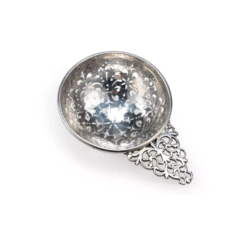 A George I/ George II Silver Lemon Strainer lacking maker, town mark and date letter, lion's head erased mark