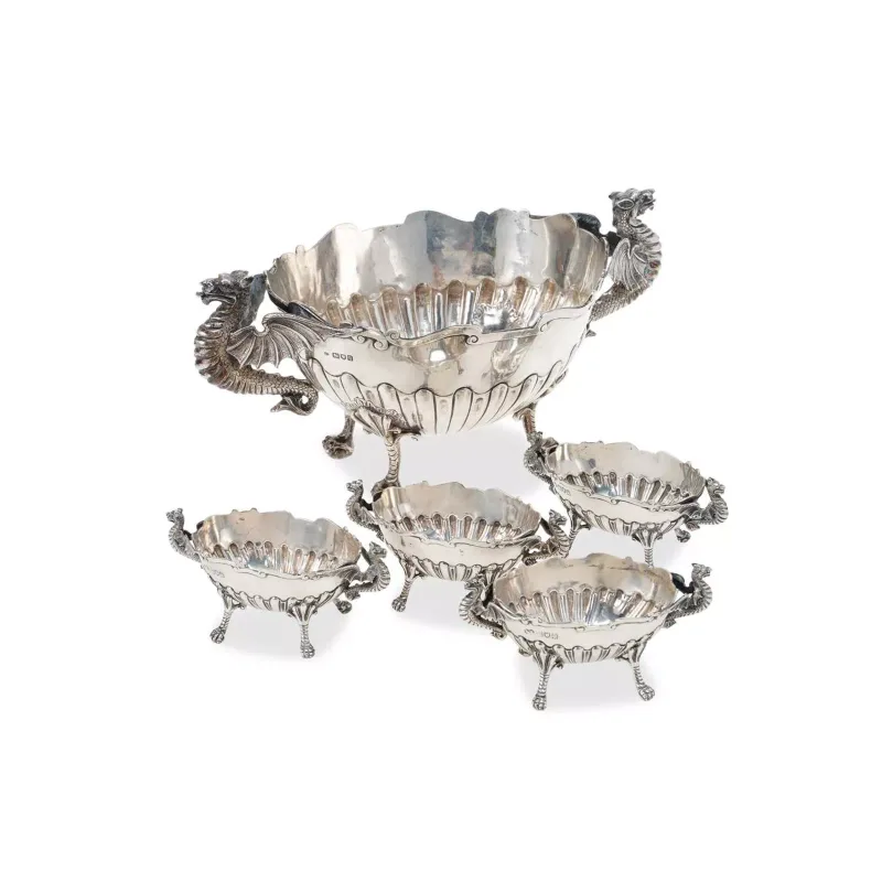 A George V Silver Two-Handled Bowl by Charles Edwards, London 1911, of oval form with part-fluted decoration, the handles modelled as dragons