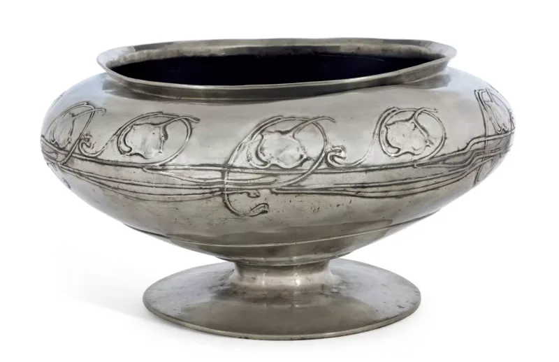 Archibald Knox (1864-1933) For Liberty & Co A Large Tudric Pewter Bowl circular form, decorated with a continuous band of stylised leaves and vine