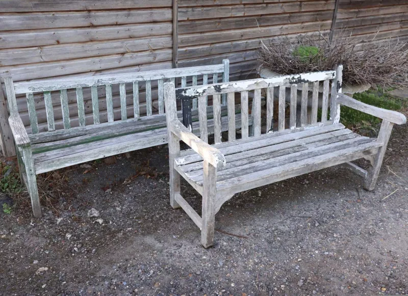 Two teak garden benches The two benches with slatted backs and seats The largest